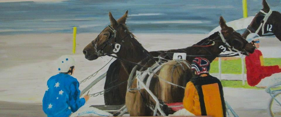 Sitting behind the horses